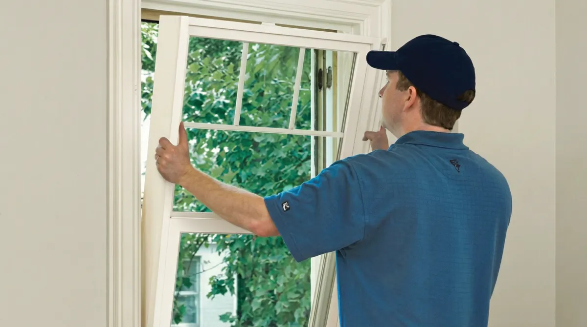 Professional contractors performing a residential window insulation and replacement service in Cape Coral, FL